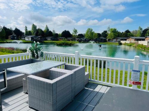 a view of a river from a deck at Lakeview Winter Lodge with Hot Tub in York