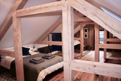 a bedroom with two bunk beds in a attic at The Post Barn, beautiful barn conversion 10mins from Winchester in Sparsholt