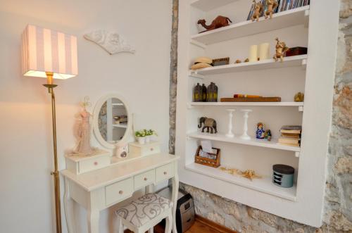 a room with a mirror and a dressing table at Villa Bocca del Perasto in Perast