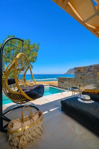 a villa with a view of the ocean at Milatos Seaside Suites in Milatos
