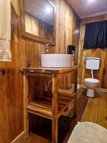 a bathroom with a sink and a toilet at CASE de ROBINSON in Lomé