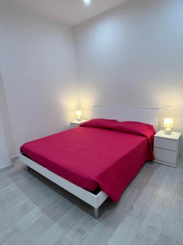 Ένα ή περισσότερα κρεβάτια σε δωμάτιο στο Case Vacanze nonna Elisa
