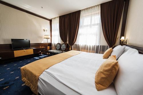 Ein Bett oder Betten in einem Zimmer der Unterkunft Hotel Europe