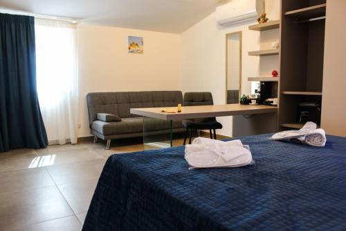 Una cama o camas en una habitación de Dalì al mare
