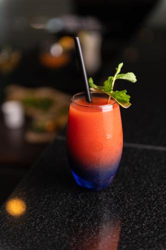 a drink sitting on top of a table at Acacia Premier Hotel in Kisumu
