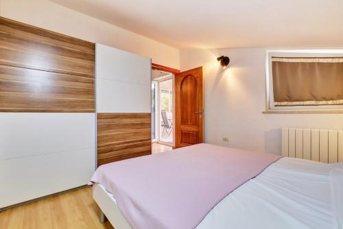 Postel nebo postele na pokoji v ubytování Apartment house UNA