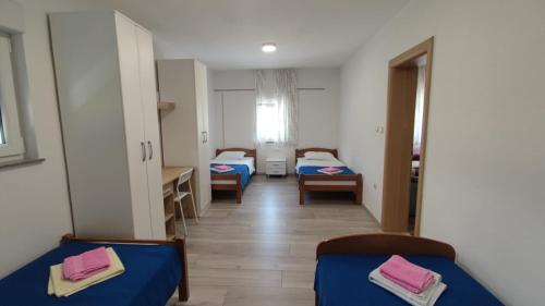 Ein Bett oder Betten in einem Zimmer der Unterkunft Casa Del Pellegrino M&A - Ostojići