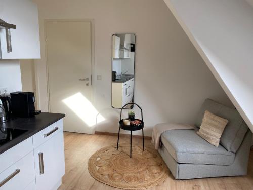 a living room with a couch and a table at FarawayHomes Studio Klagenfurt #2 in Klagenfurt