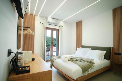 Katil atau katil-katil dalam bilik di Omnia Deluxe Rooms