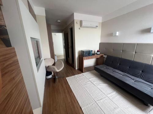 a living room with a couch and a table at Linhares Design Hotel in Linhares
