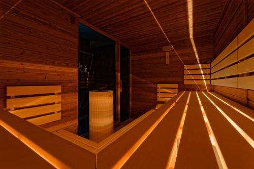 an empty sauna with wooden walls and wooden floors at Hotel Stara Skola in Sloup