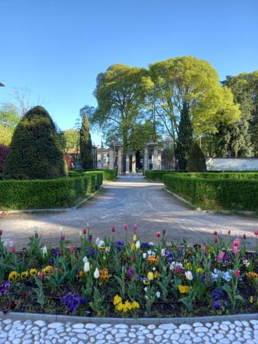 a garden with flowers in the middle of a road at Vivila - Ca' Foulard in Cernusco sul Naviglio