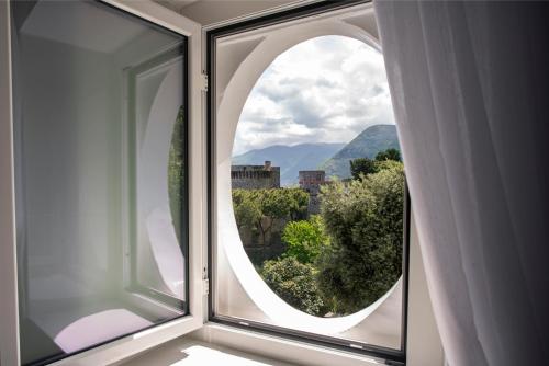 anorthole window with a view of a mountain at Relais al Castello in Castellammare di Stabia