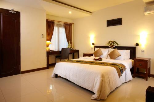 Ένα ή περισσότερα κρεβάτια σε δωμάτιο στο Putu Bali Villa & Spa