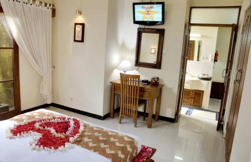 Ένα ή περισσότερα κρεβάτια σε δωμάτιο στο Putu Bali Villa & Spa