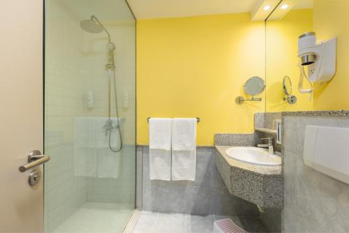 a bathroom with a shower and a sink at Abora Continental by Lopesan Hotels in Playa del Ingles