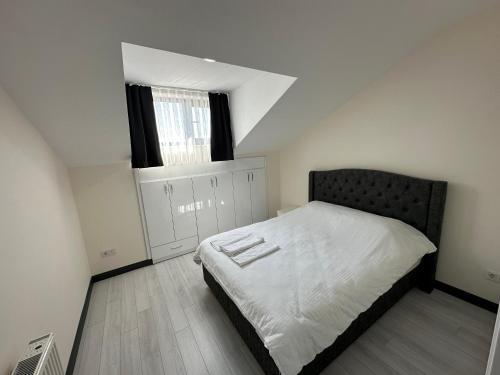 Ένα ή περισσότερα κρεβάτια σε δωμάτιο στο Rose Plus Residence
