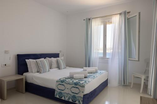 Amaris Mykonian Residenceにあるベッド
