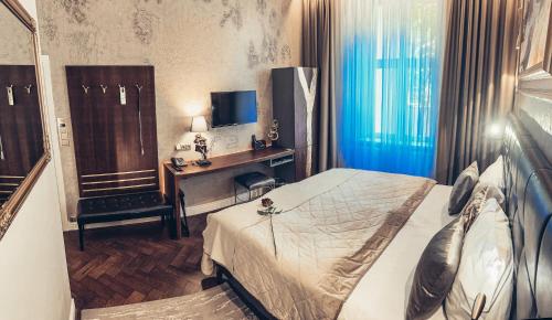 Alfons Boutique Hotelにあるベッド