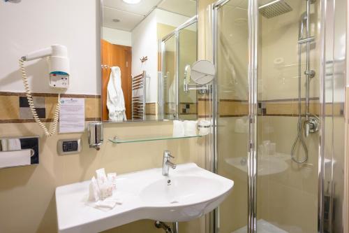 a bathroom with a sink and a shower at Hotel Dei Principati in Baronissi