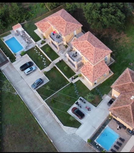 an overhead view of a house with cars parked in front at Résidence Pasturella in Bastia