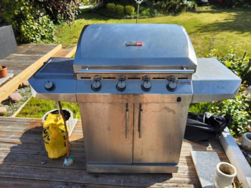 a grill sitting on top of a wooden deck at 6 Room Holiday House, Private Garden, Lego House, Legoland, Lalandia, in Billund