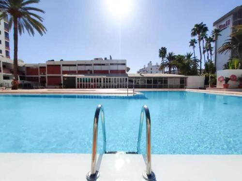a swimming pool at a hotel with a resort at Danubio Beach - Playa del Inglés in Maspalomas