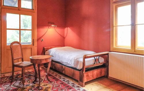 a bedroom with a bed and a table and a chair at Nice Home In Igls With Wifi in Innsbruck