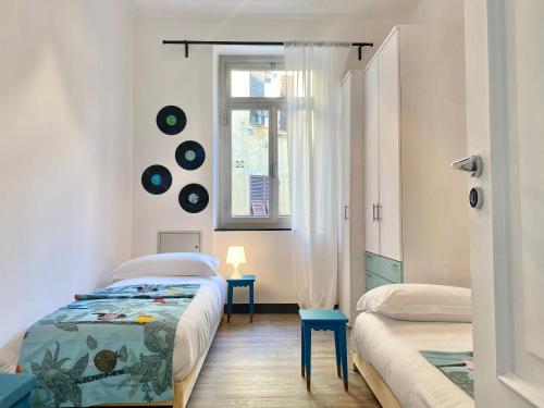 Ліжко або ліжка в номері CasaViva - Amazing Trilo with view in Genova