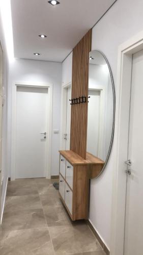 a dressing room with a mirror on the wall at Illyrian Elite Gjiri i Lalezit in Draç