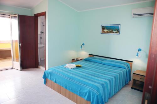 Postel nebo postele na pokoji v ubytování A Turri Rooms and Restaurant
