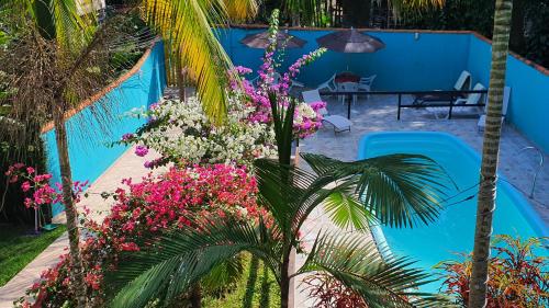 A piscina localizada em Pousada Tropical Araçatiba ou nos arredores