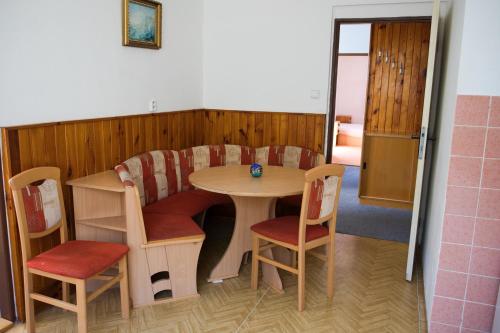 a small table and chairs in a room at Penzion Diana in Železná Ruda