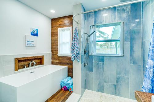 a bathroom with a sink and a shower at Pet-Friendly Cocoa Beach Vacation Rental! in Cocoa Beach