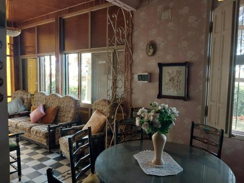 a living room with a table and a couch at Casa de Campo Finca La Superiora in La Consulta