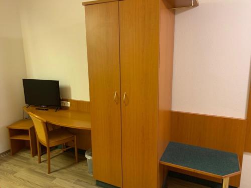 TV a/nebo společenská místnost v ubytování Hotel Gaststätte Weinbrücke