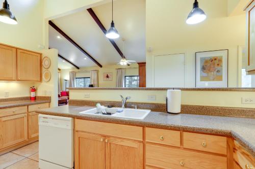 a kitchen with wooden cabinets and a sink at Spacious Flagstaff Vacation Rental - 1 Mi to Dtwn in Flagstaff