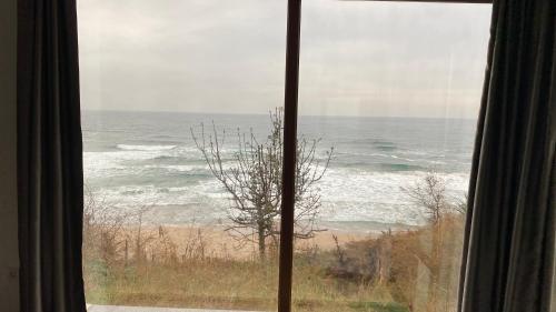 a view of the ocean from a window at Palm Beach Şile Villa Hotels in Istanbul