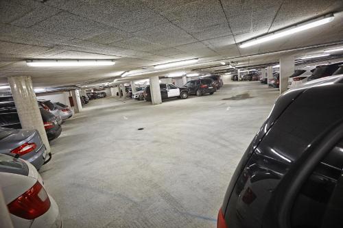 a parking garage with cars parked in it at Hotel Planai by Alpeffect Hotels in Schladming
