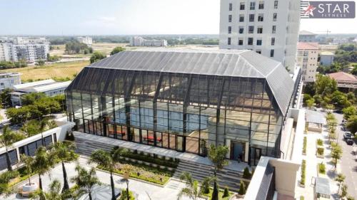 an overhead view of a building with a glass facade at Happiest Homestay 2 - Manor Crown Hue in Thôn Trường Giang