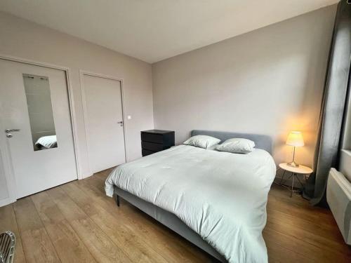 Ένα ή περισσότερα κρεβάτια σε δωμάτιο στο Le minage - Coeur de ville