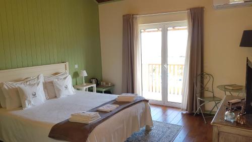 Ένα ή περισσότερα κρεβάτια σε δωμάτιο στο Quinta do Outono