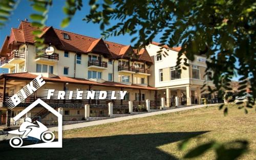 a rendering of a hotel with a scooter in front of it at Pensiunea Carmen - Bikers Friendly Nest in Sibiu