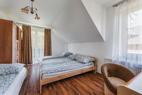 Ένα ή περισσότερα κρεβάτια σε δωμάτιο στο Dom Zaskalskie 10b