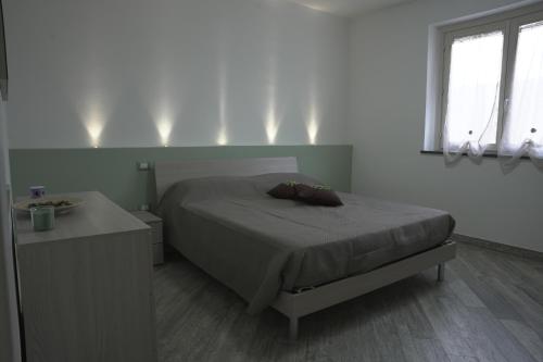 Postel nebo postele na pokoji v ubytování L'ANGOLO VERDE