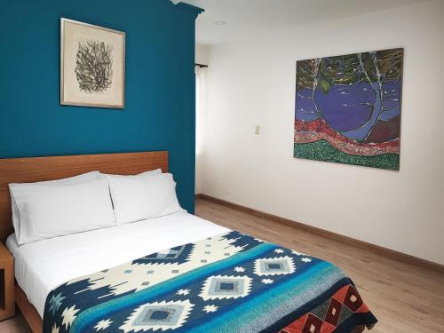 Ένα ή περισσότερα κρεβάτια σε δωμάτιο στο Hotel Casa Merced