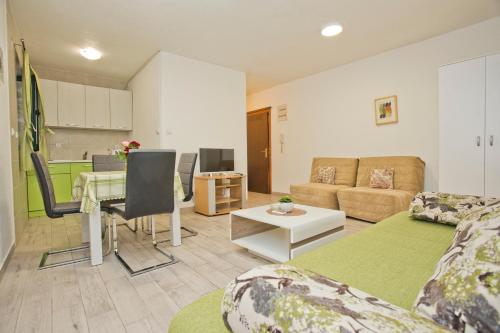 a living room with a couch and a table at Villa Iva in Kotor