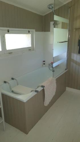 a bathroom with a sink and a window at Chez Martine in Hanc