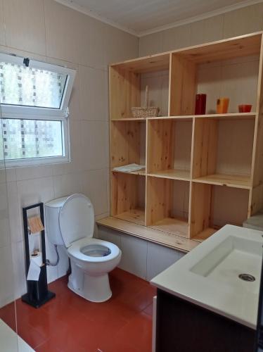 a bathroom with a toilet and a sink at Villa Visconde in Nordeste