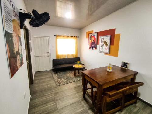 a living room with a table and a couch at Guajira House in Ríohacha